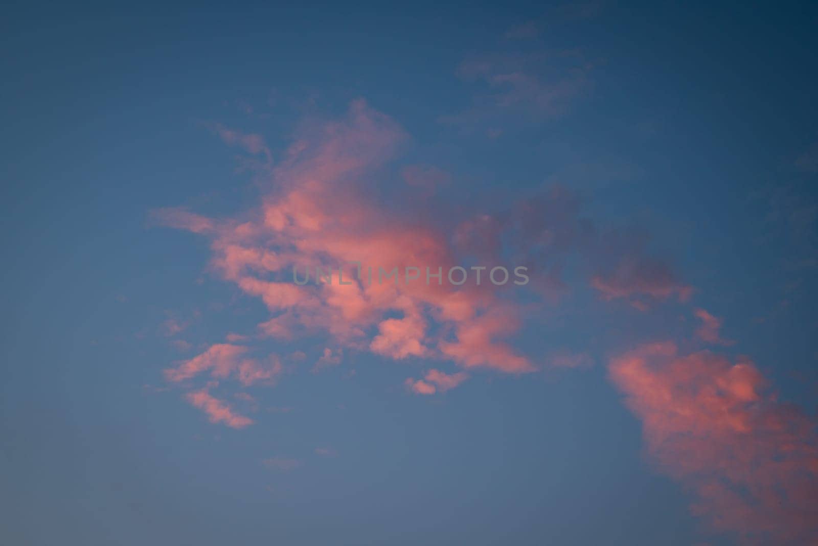 Vibrant burning clouds in sky during sunset by VitaliiPetrushenko