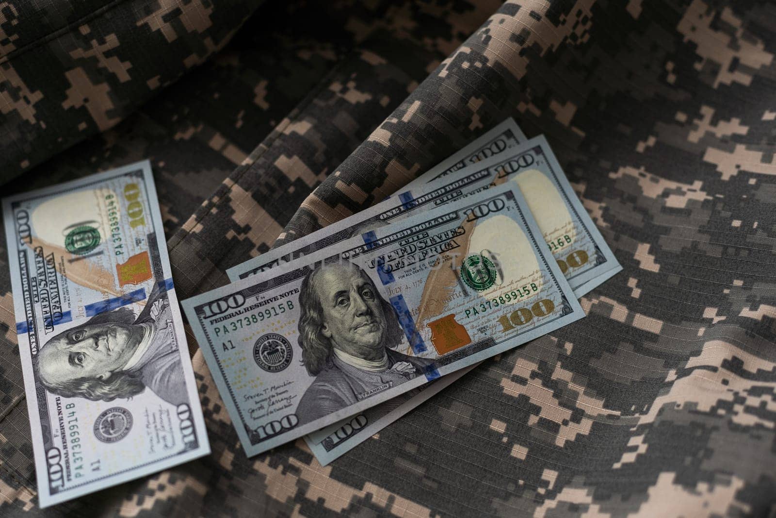 American dollars banknotes on military pixel background. High quality photo