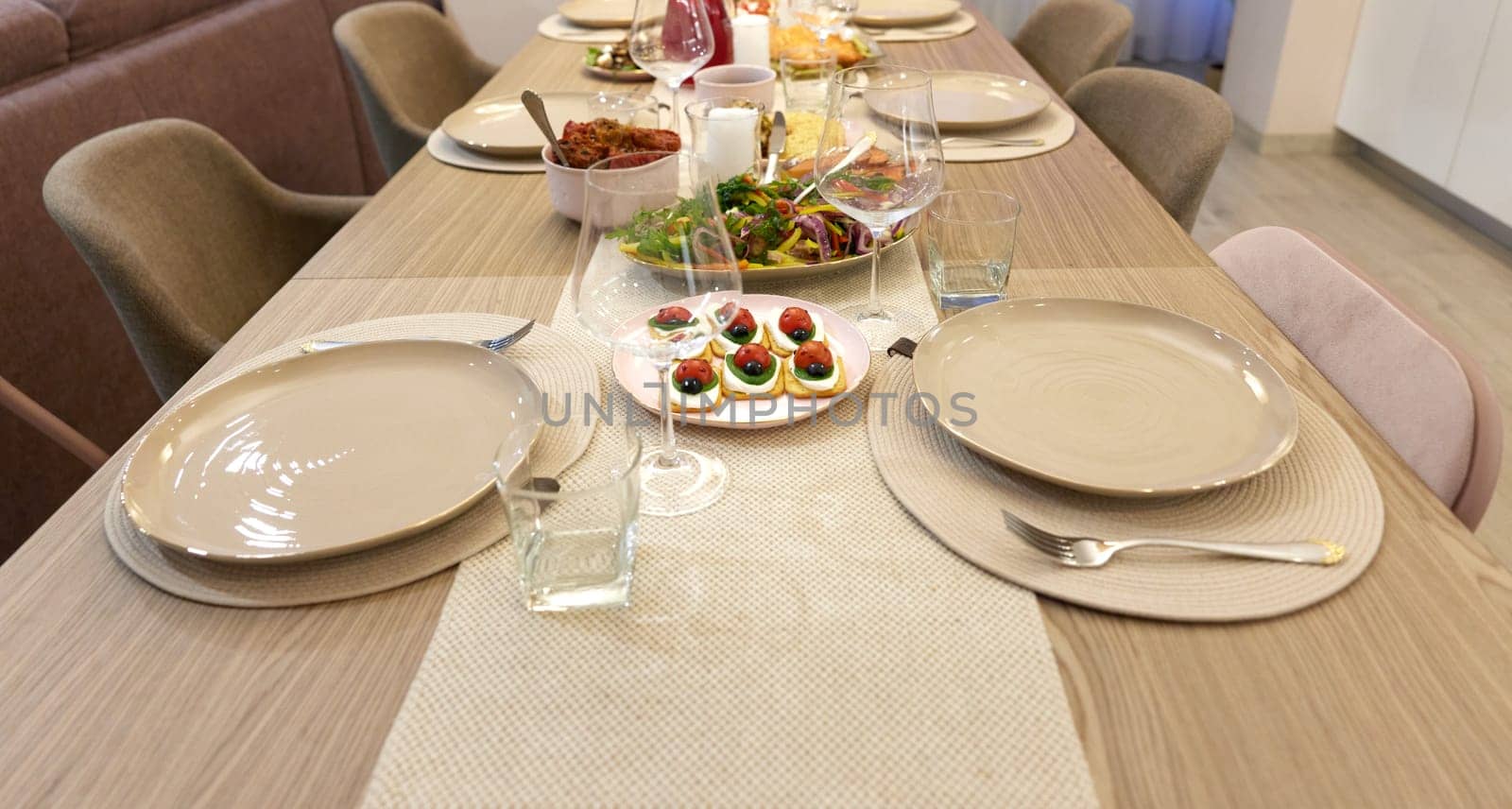 Table served for festive dinner in living room