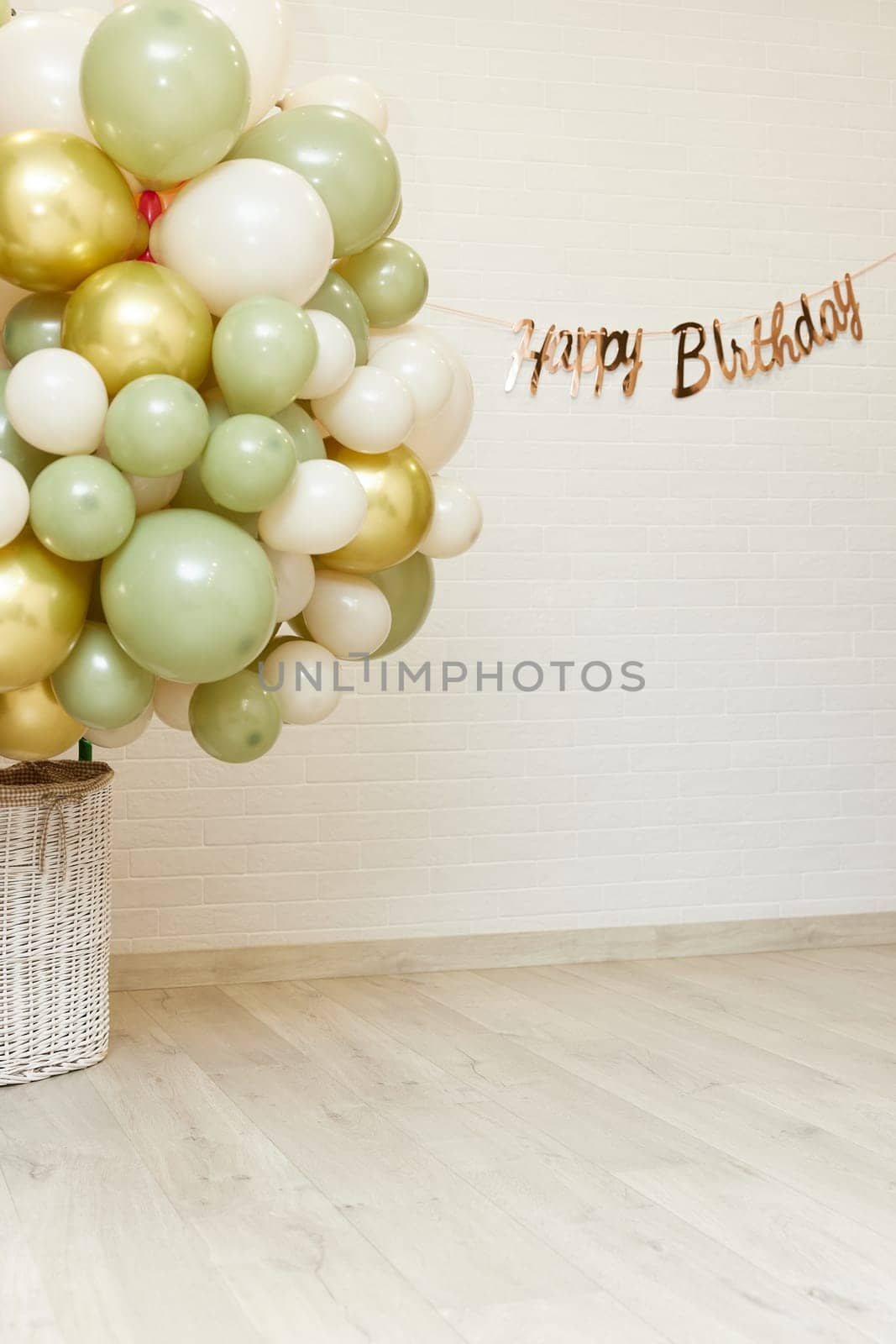 Many white green and gold balloons and Happy Birthday golden texts , party even