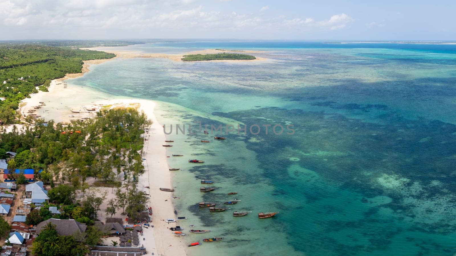 Zanzibar panorama of the fishing boats on tropical sea coast at sunny day by Robertobinetti70
