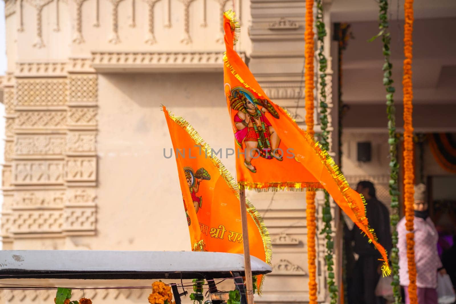 Zoomed shot showing crowd of people carrying flag celebrating the Pran Pratishtha consecration of Ram mandir temple massive celebration in India by Shalinimathur