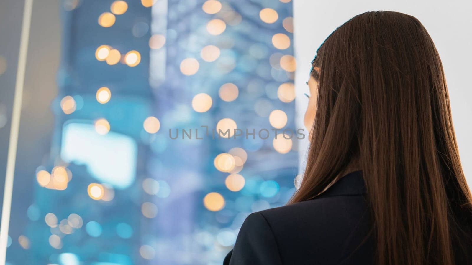 business woman with the new year 2024 for her eyes. Businesswoman looking at blurred blue background, Business happy new year 2024 cover concept. High quality image