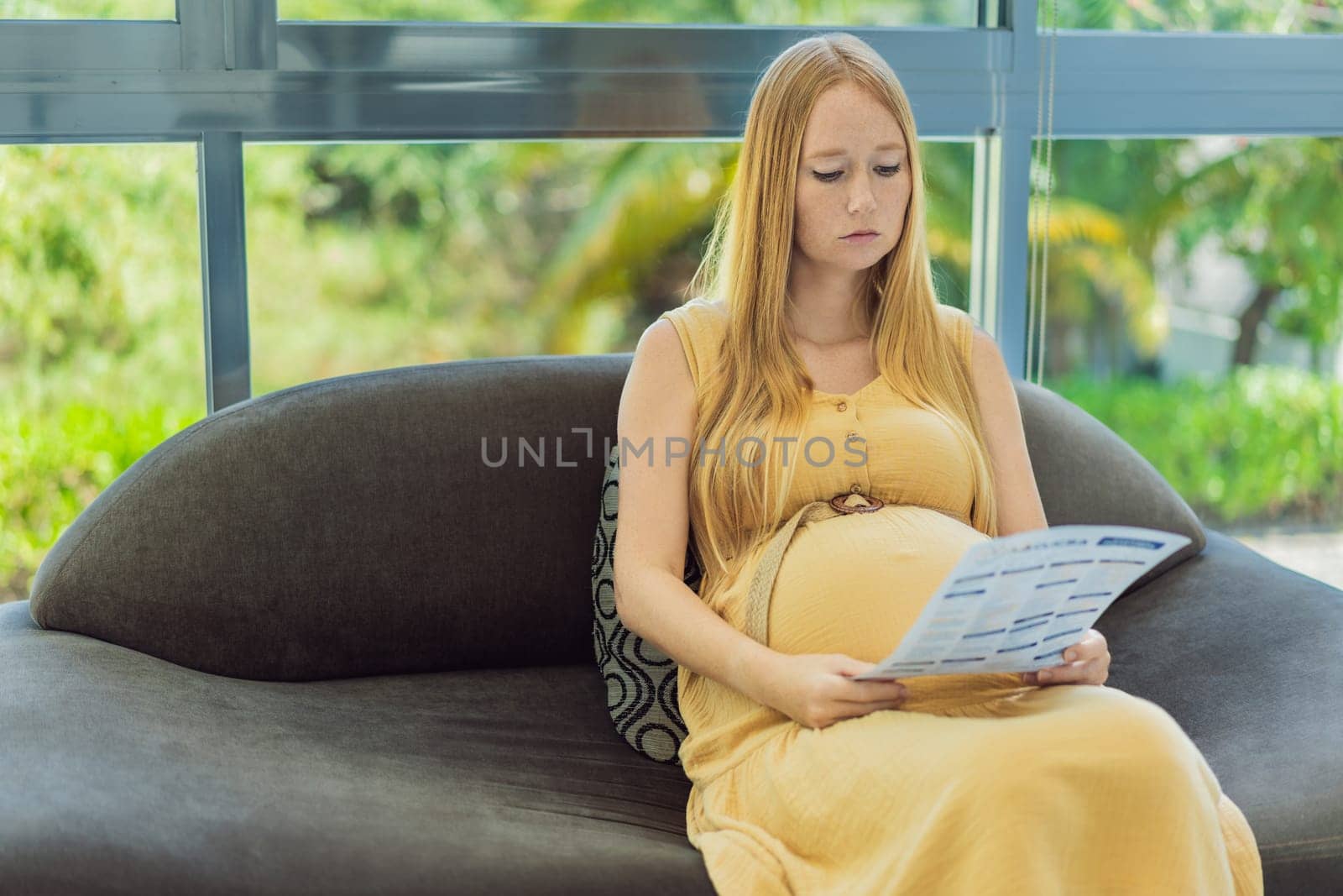 Expectant woman reviews her blood test results, contemplating the health of her pregnancy by galitskaya
