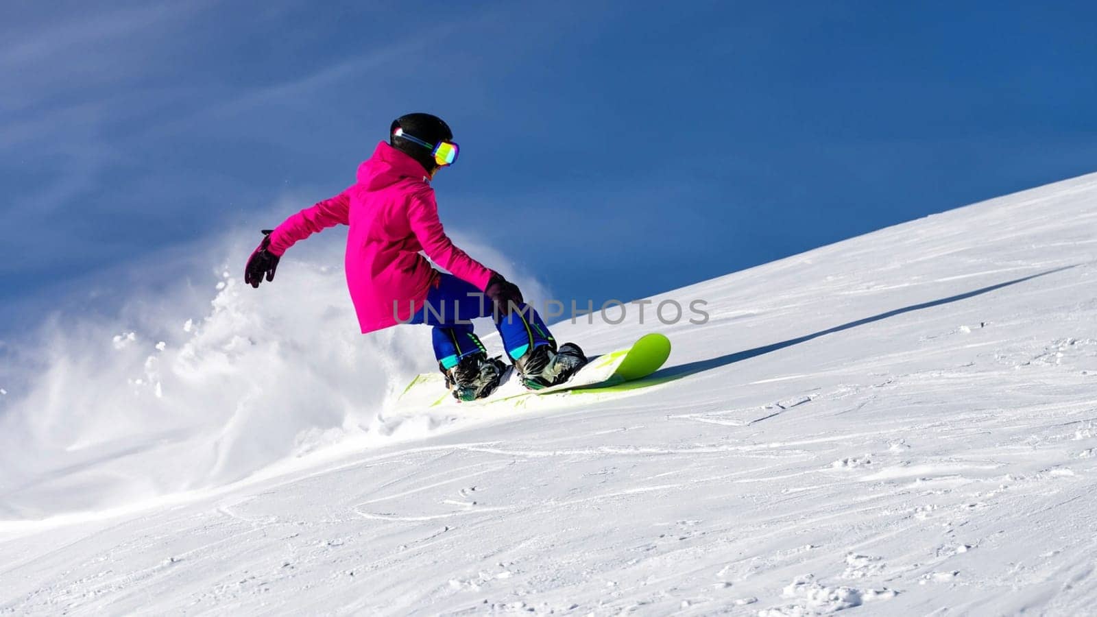 Snowboarder sliding down the hill. High quality photo