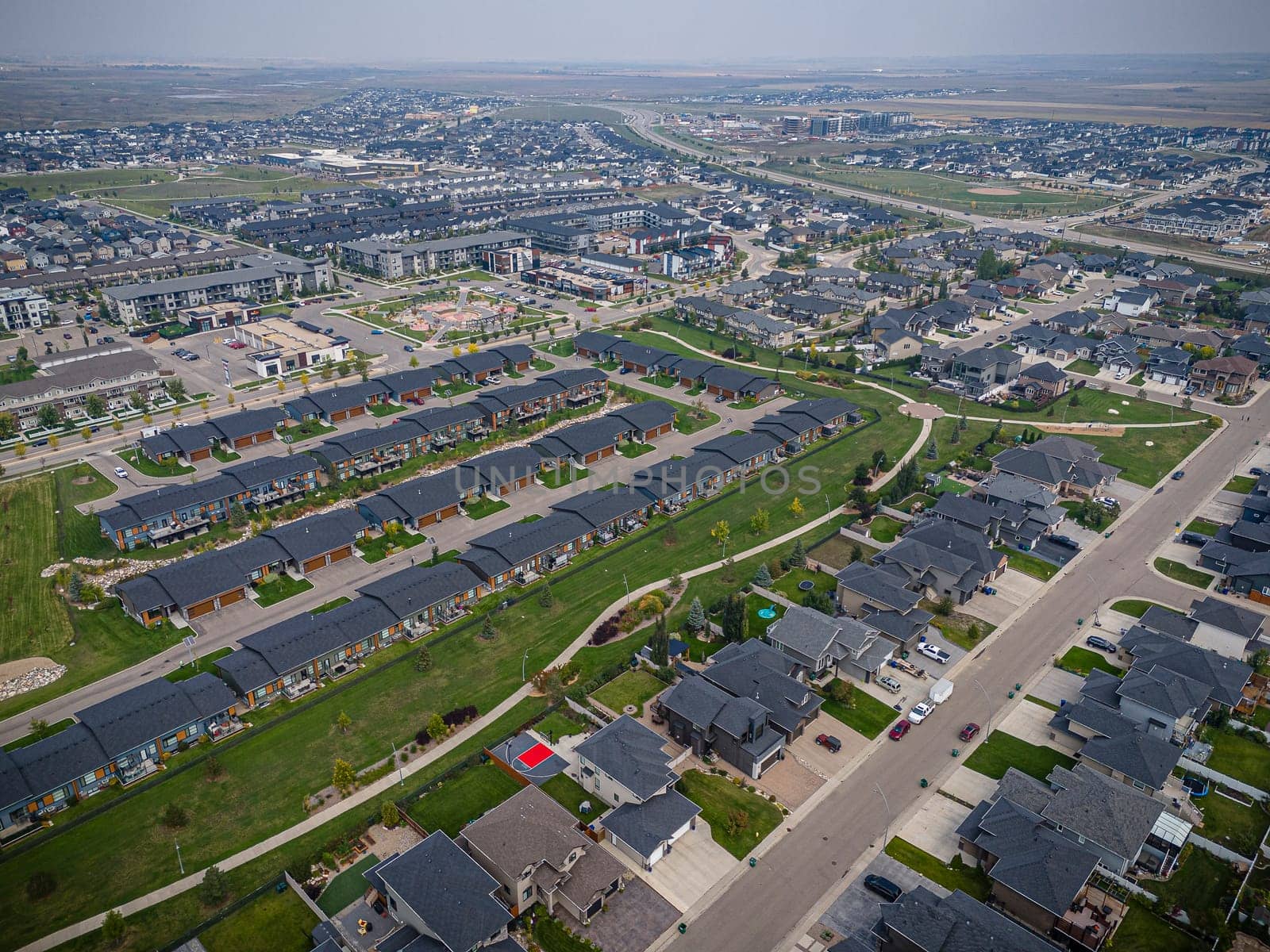 Drone capture of Evergreen, Saskatoon, highlighting its unique layout and lush green spaces.