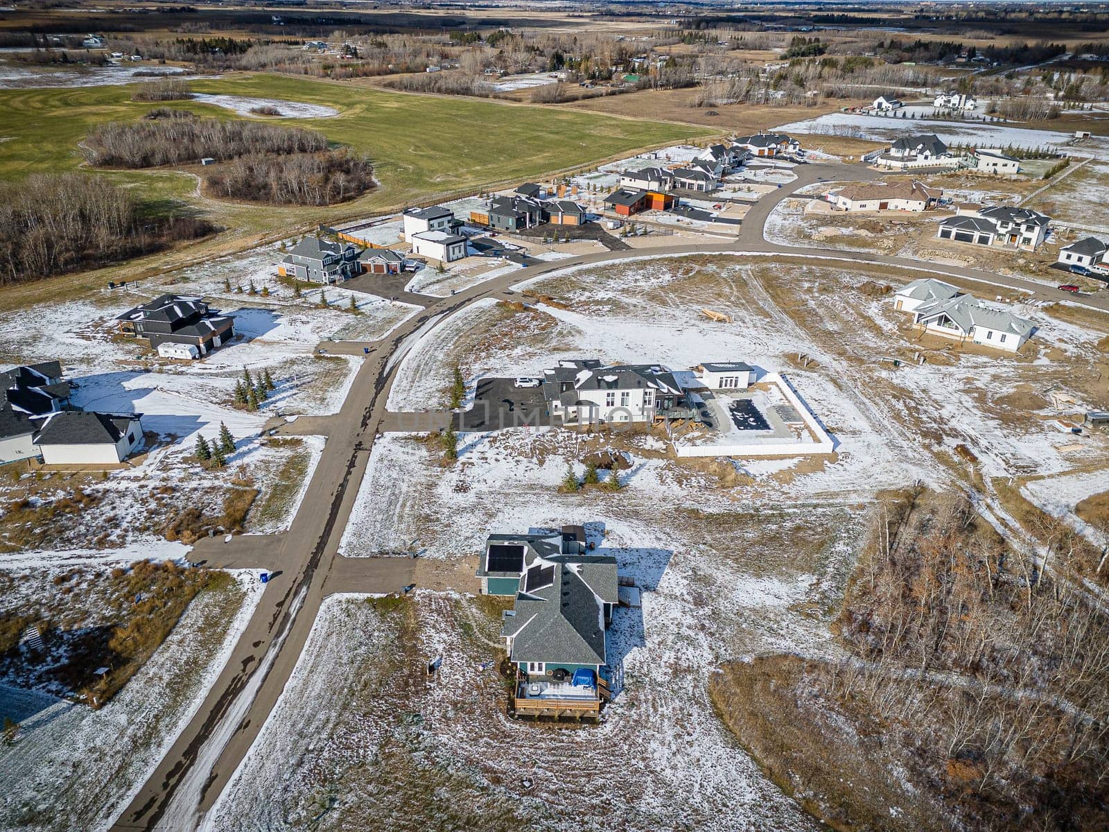 Drone image showcasing the beauty of Grasswood Estates in Saskatoon, Saskatchewan, with its spacious residential properties and natural surroundings