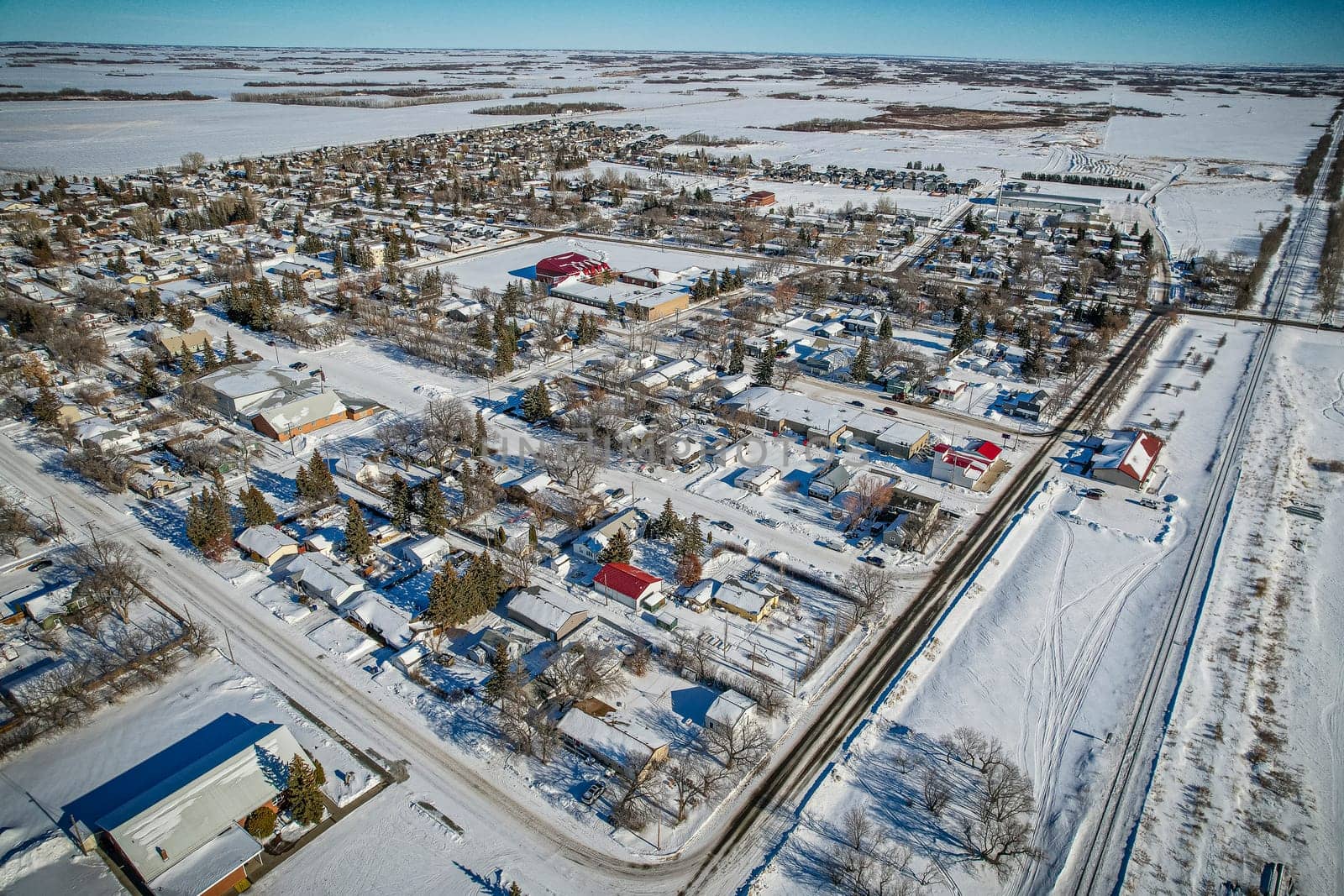 Drone image capturing the town of Dalmeny in Saskatchewan, showcasing its charming suburban setting and community atmosphere.