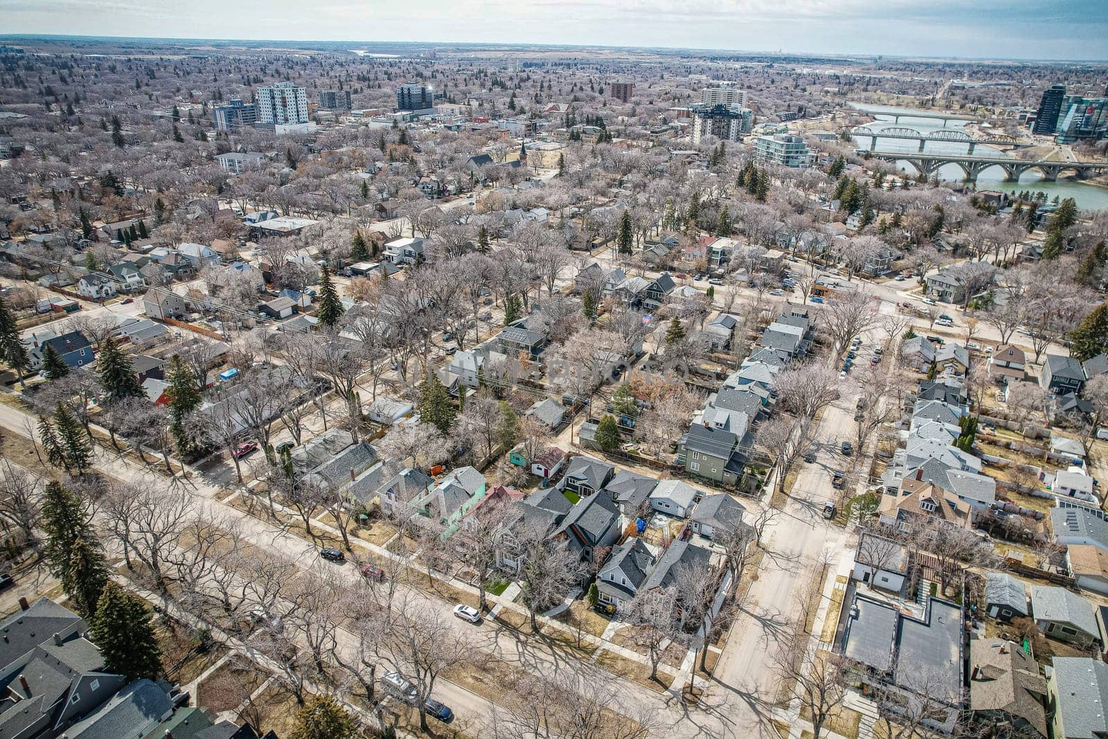 Drone image showcasing the charm of Nutana, Saskatoon, with its residential areas, greenery, and community spaces