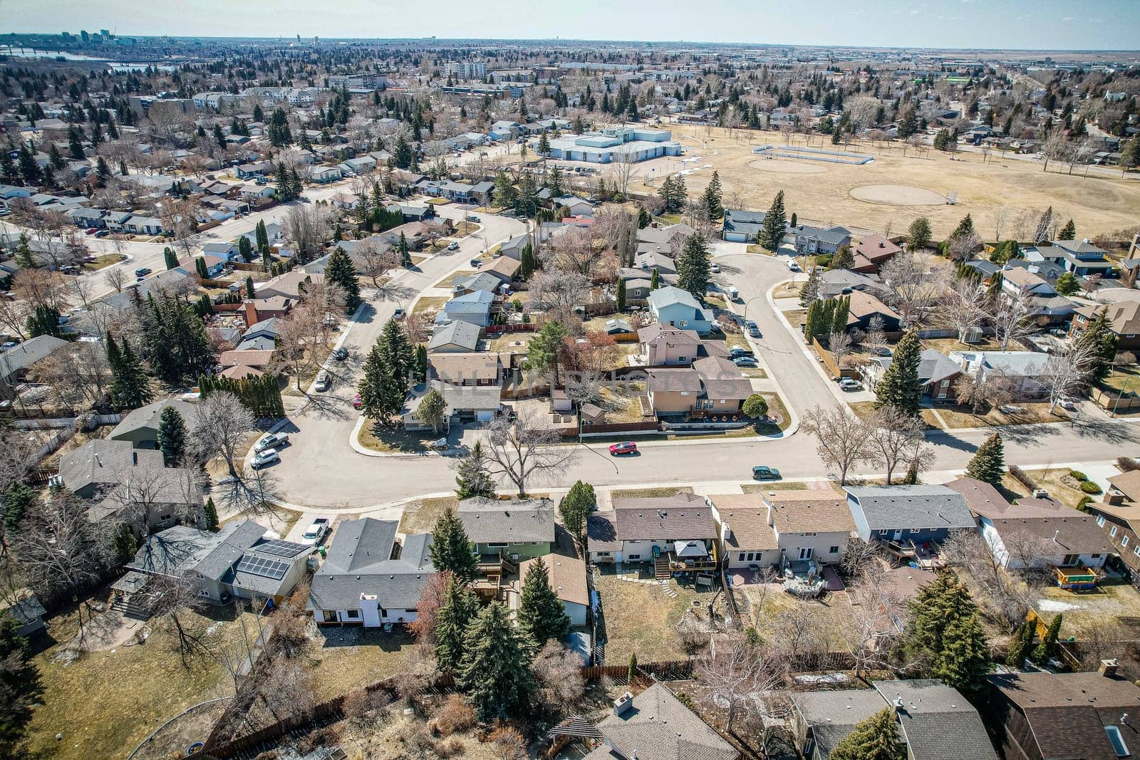 Overhead drone image of Lawson Heights, Saskatoon, highlighting its residential layout and vibrant community.