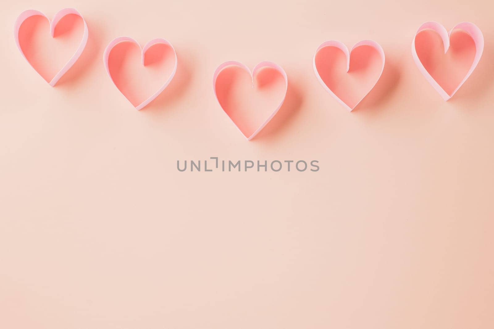 Happy Valentines Day. Above pink ribbon heart shaped decorative symbol isolated on pastel pink background, love romance concept, template banner design with copy space, Mother, Woman day