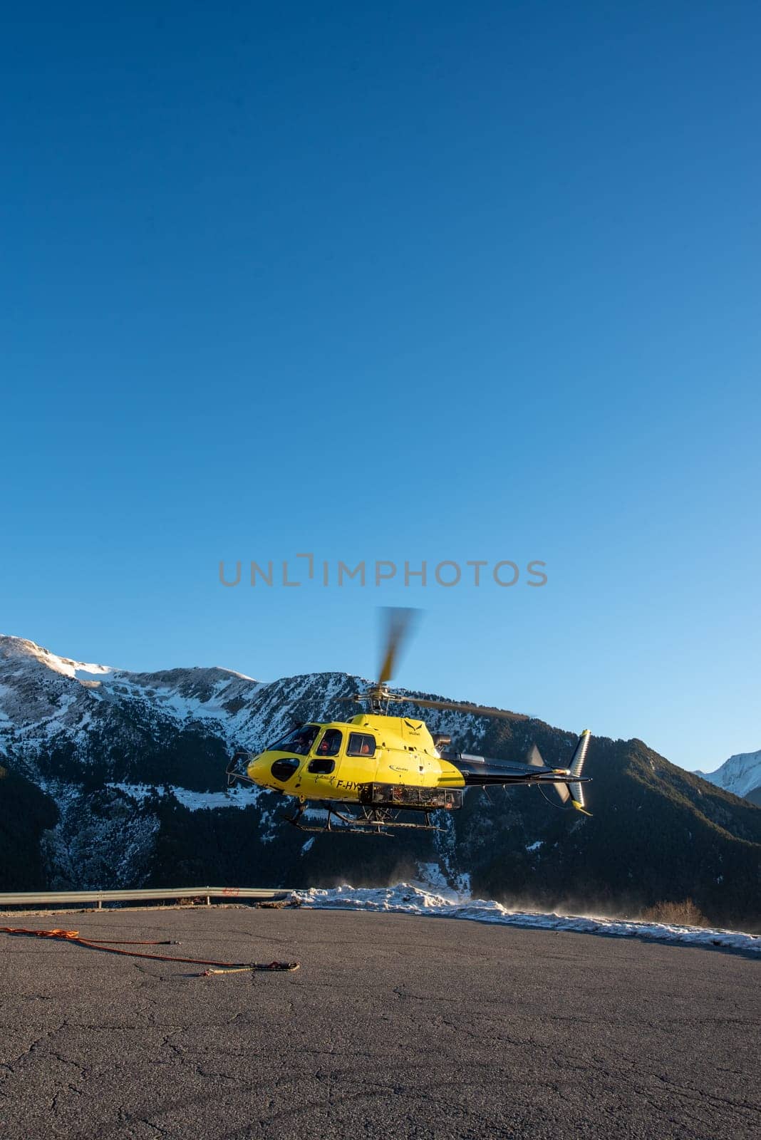 Arinsal, Andorra: 2024 January 21: Rescue helicopter at the 2024 Ski Mountaineering World Cup at the Pal - Arinsal ski resort in 2024.