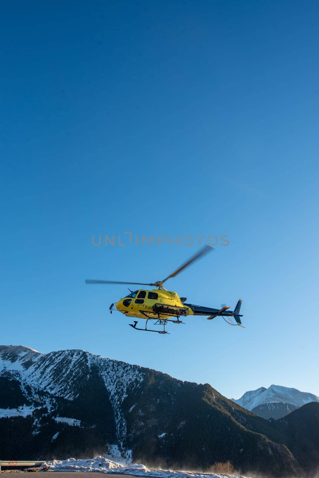 Arinsal, Andorra: 2024 January 21: Rescue helicopter at the 2024 Ski Mountaineering World Cup at the Pal - Arinsal ski resort in 2024.