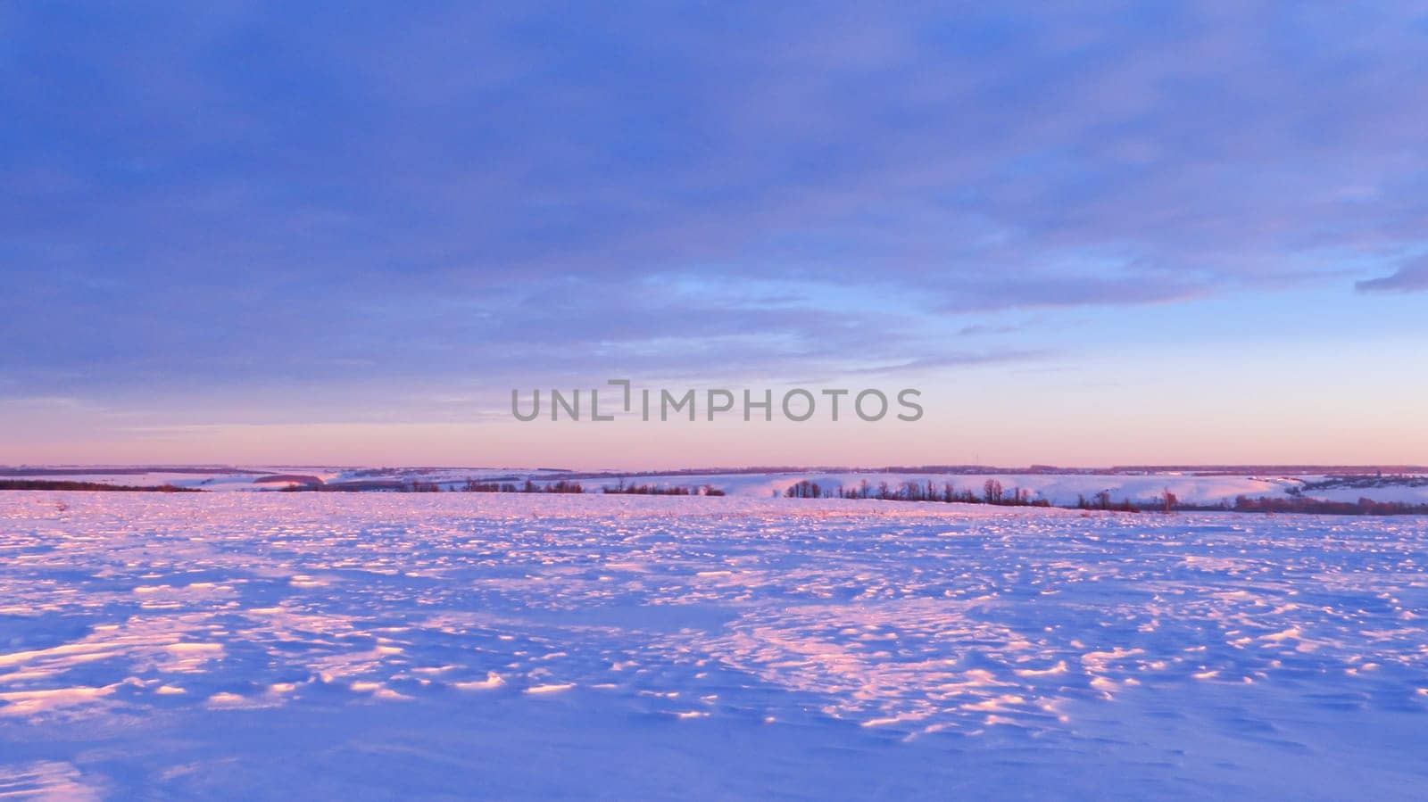 Winter snow hills in a field at sunset by KCreeper