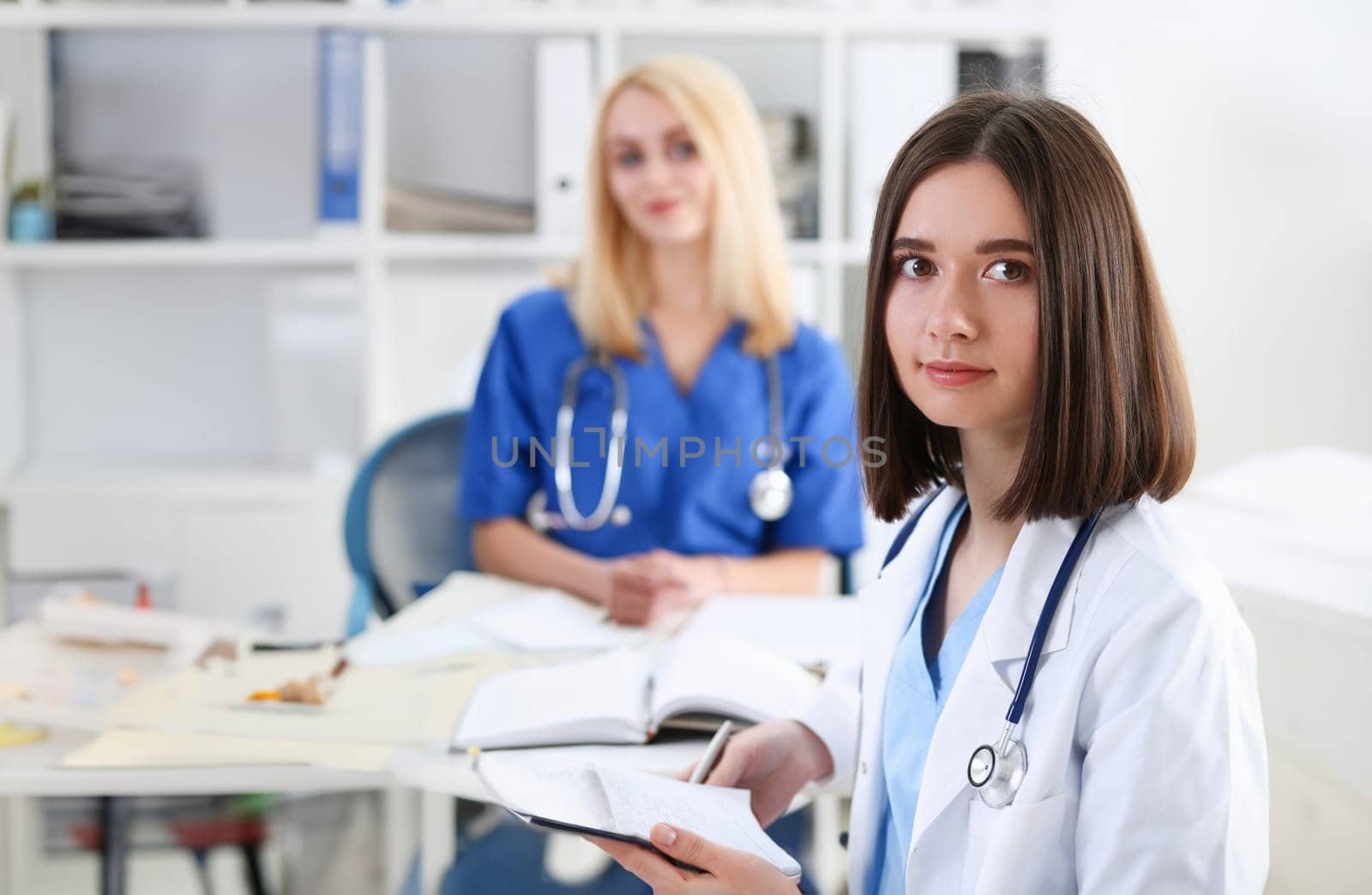 Beautiful smiling female doctor stand in office portrait. Physical and patient disease prevention, exam er ward round 911 prescribe remedy healthy lifestyle consultant nurse profession concept