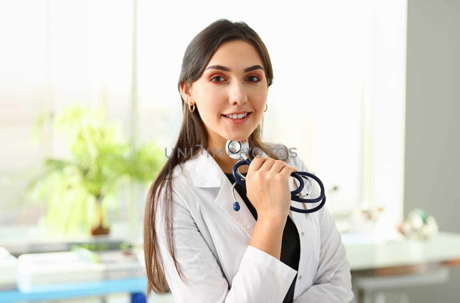 Beautiful smiling female doctor at workplace portrait. Physical and disease prevention patient aid exam visit 911 ward round prescribe remedy healthy lifestyle consultant profession concept