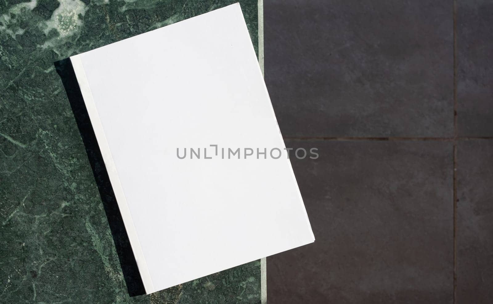 Magazine cover mockup design. blank magazine mockup on green marble stone coffee table , shadow overlay, top view