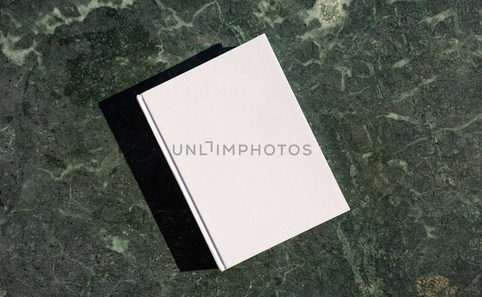 blank book mockup on green marble stone coffee table , shadow overlay by Desperada