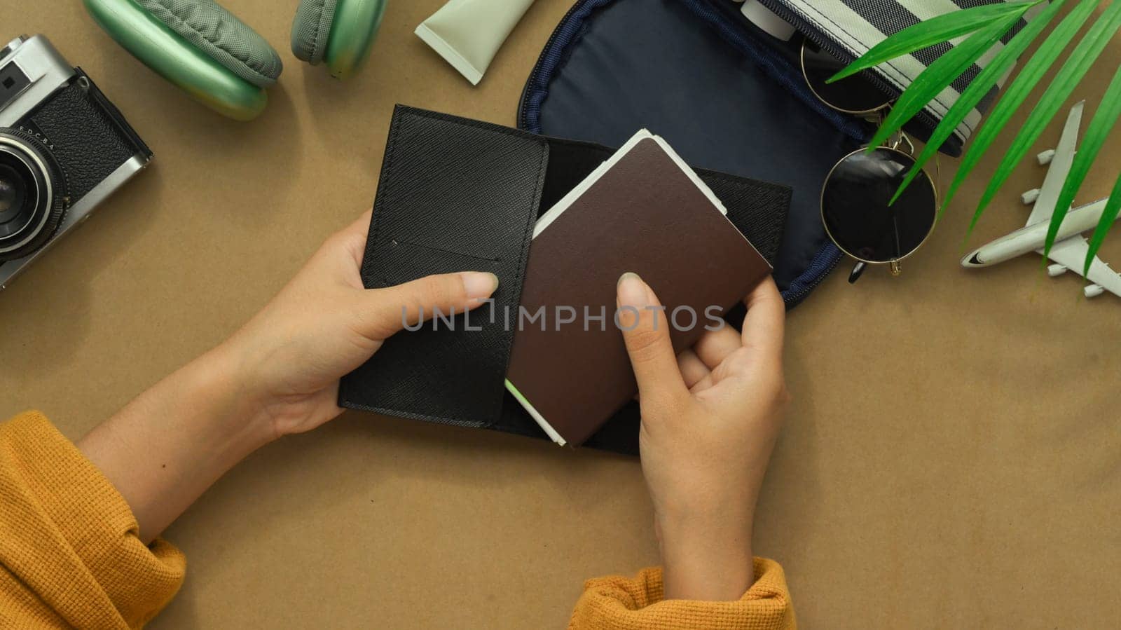 Above view hands holding passport. Ready to Travel, vacation and journey concept