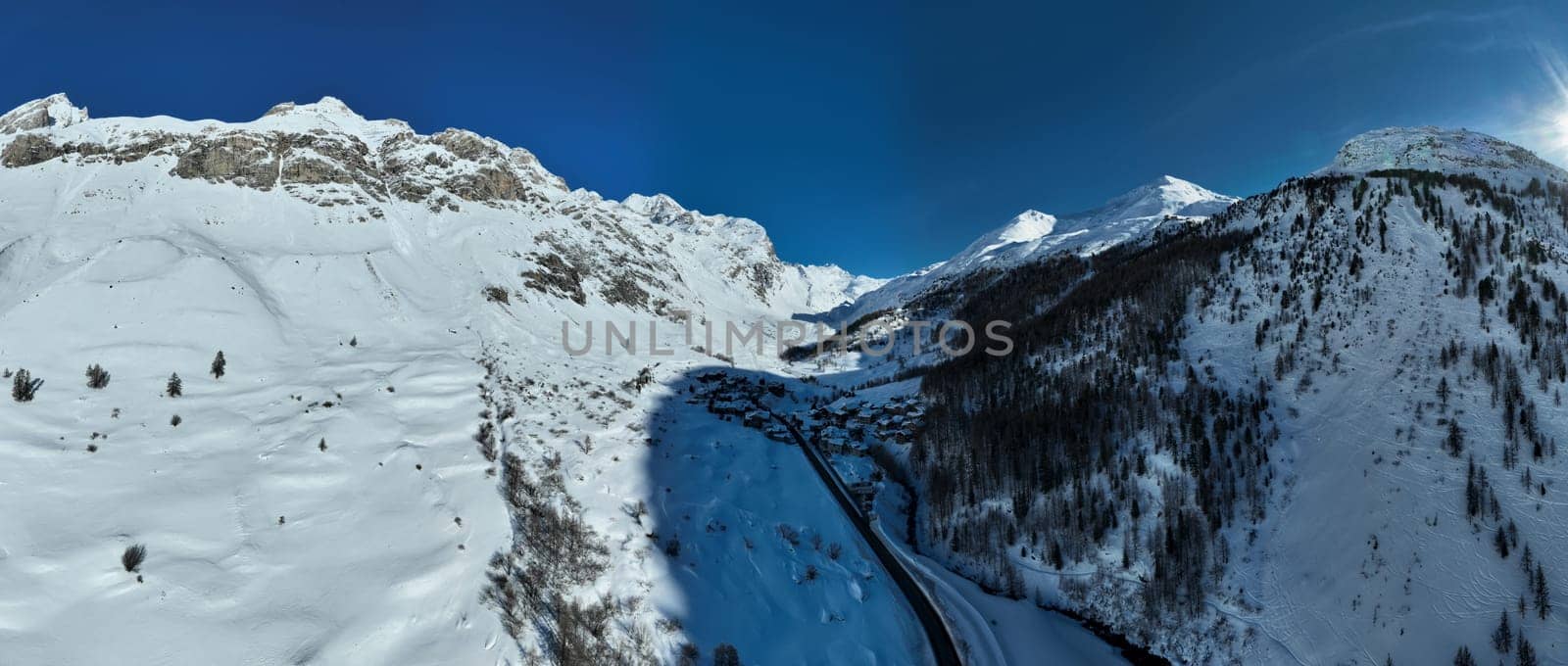 Winter drone shot of ski pistes and slopes covered with fresh powder snow in Tignes in Valdisere France by dotshock