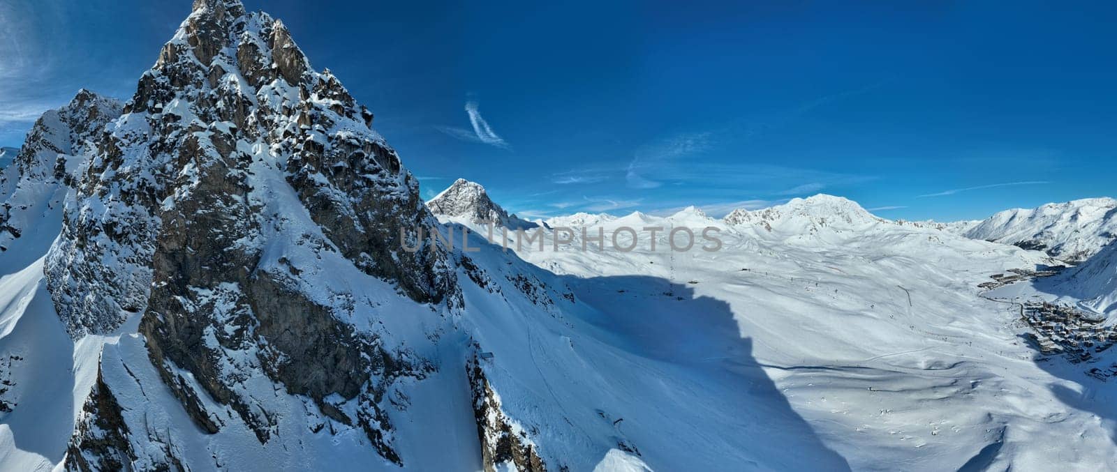 Winter drone shot of ski pistes and slopes covered with fresh powder snow in Tignes in Valdisere France by dotshock