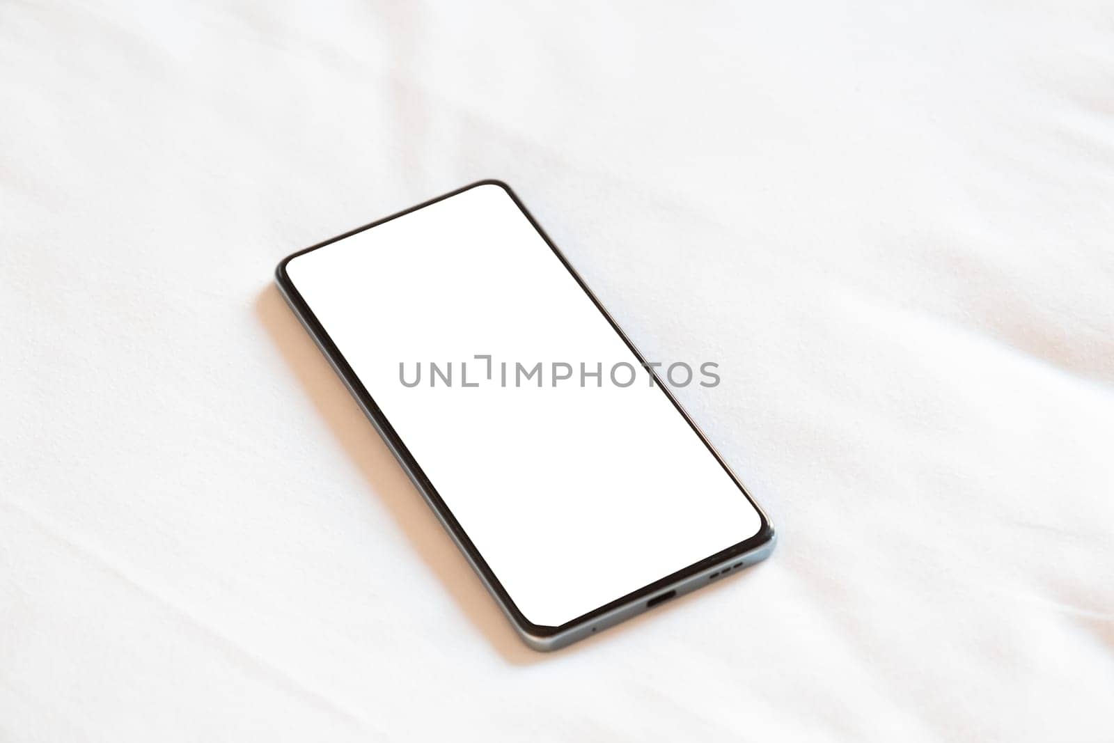 Travel concept. smartphone screen mockup on bed