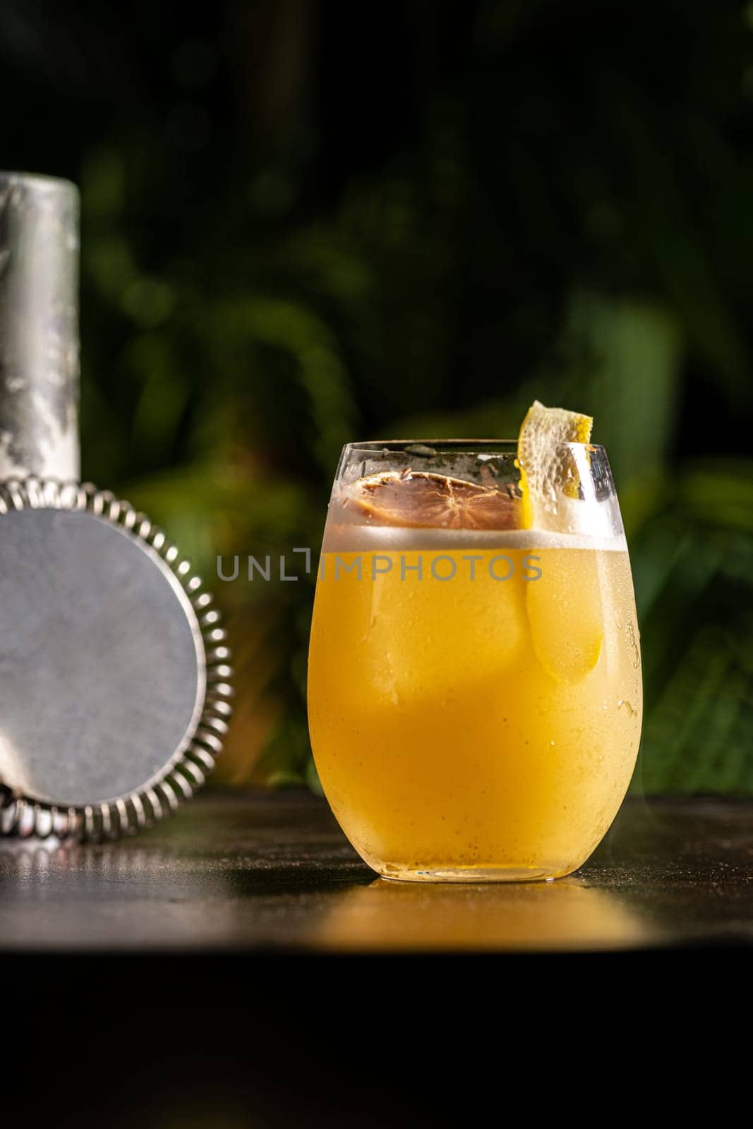 Luxury cocktail on the wooden table on a dark background