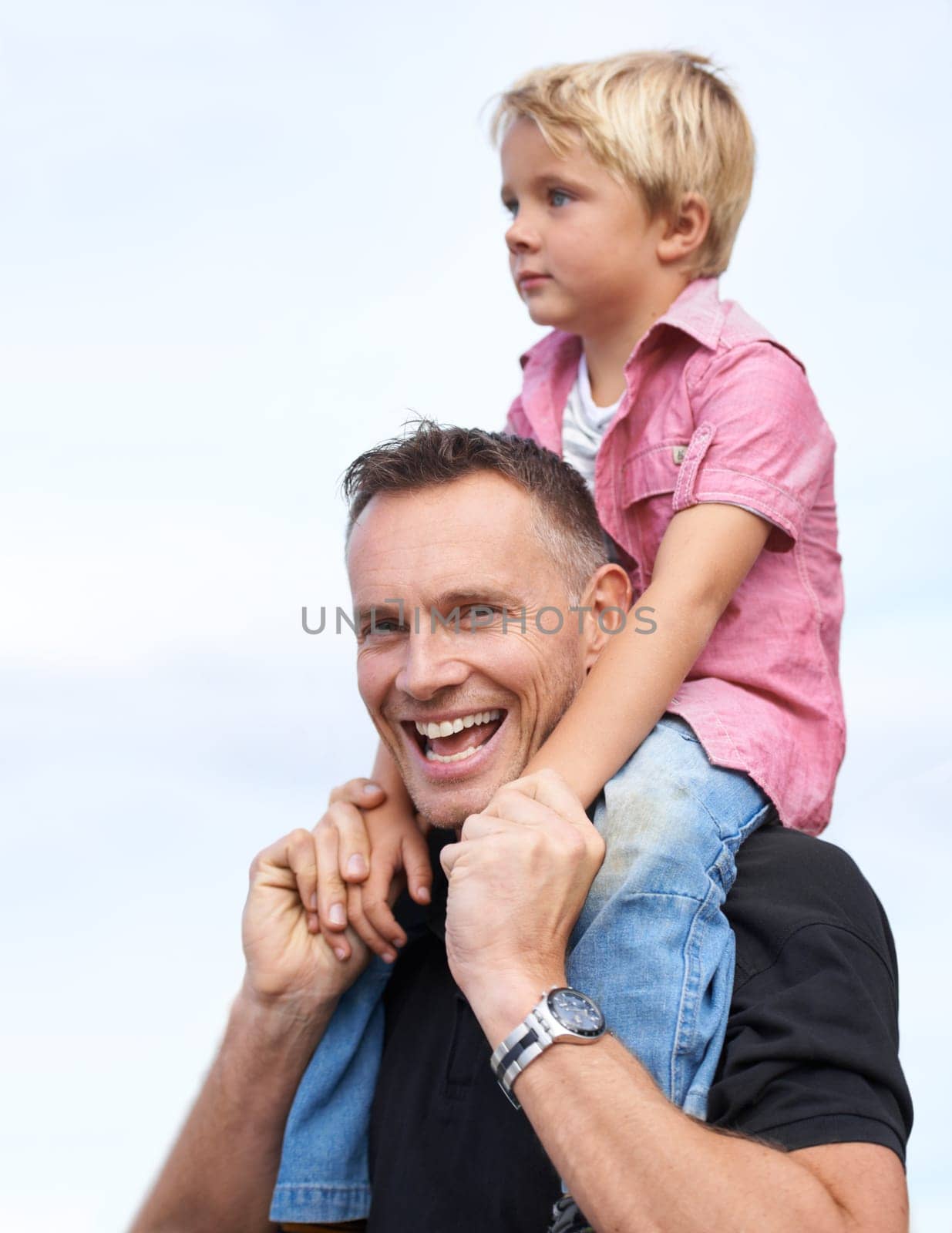 Love, portrait and piggyback by father and son outdoor for fun, bonding or travel adventure. Happy family, support or parent with boy kid outside for shoulder ride, games or care, security or journey by YuriArcurs