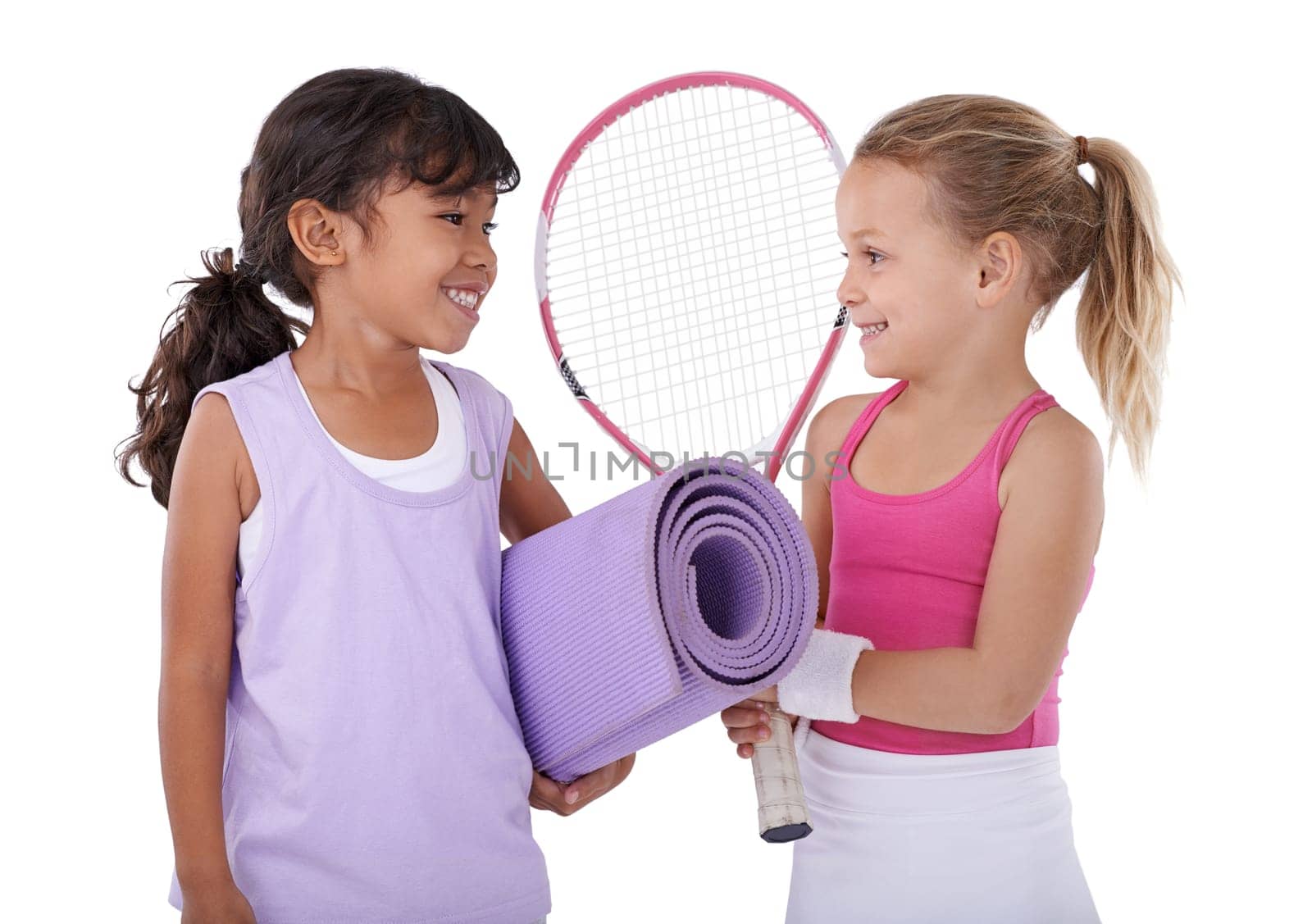 Tennis, happy and children on a white background for sports training, workout and exercise. Fitness, friends and isolated young kids with yoga mat, racket and gym equipment for hobby in studio by YuriArcurs