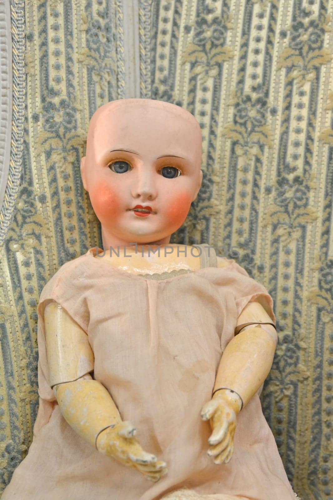 Old french doll in a flea market