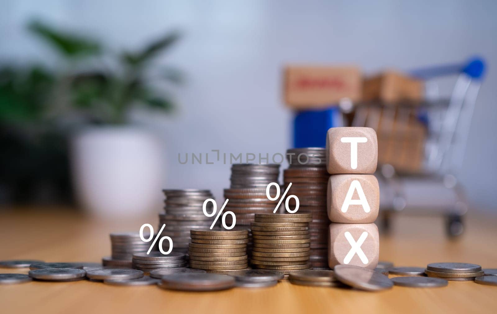 Tax wooden letter, Tax concept.Income tax return, Tax payment and tax deduction planning involve strategies to minimize tax liability, deferring income, tax professional. by Unimages2527