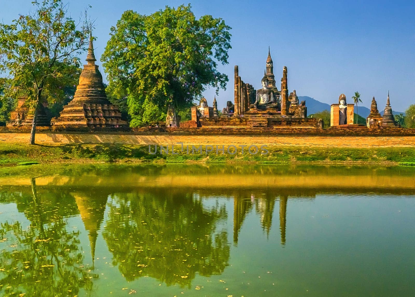 Wat Mahathat temple in Sukhothai historical park by day, UNESCO World Heritage Site, Thailand