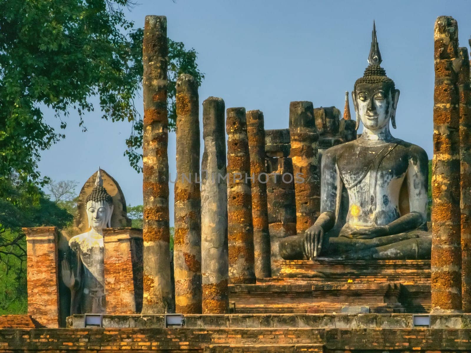 Buddha at Wat Mahathat temple in Sukhothai historical park by day, UNESCO World Heritage Site, Thailand
