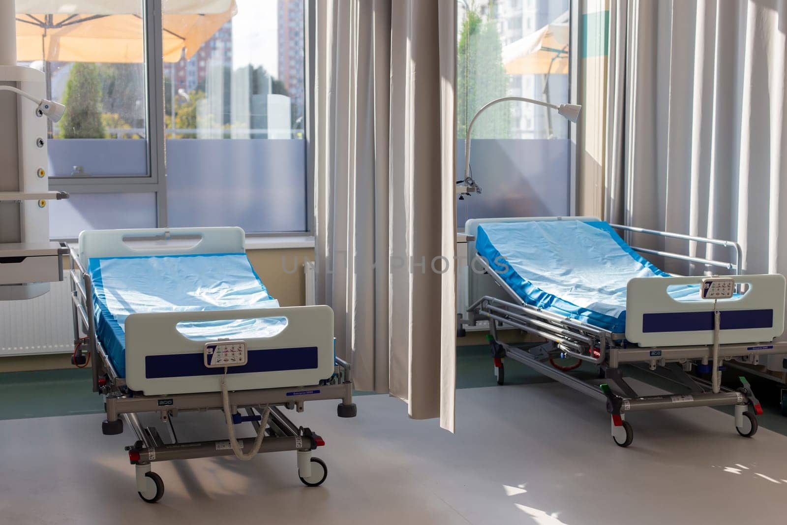 Moscow, Moscow region, Russia - 03.09.2023:Brightly lit hospital room with multiple beds and medical equipment