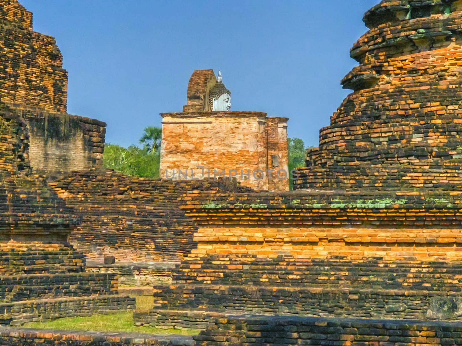 Wat Mahathat temple in Sukhothai historical park, UNESCO World Heritage Site, Thailand by Elenaphotos21