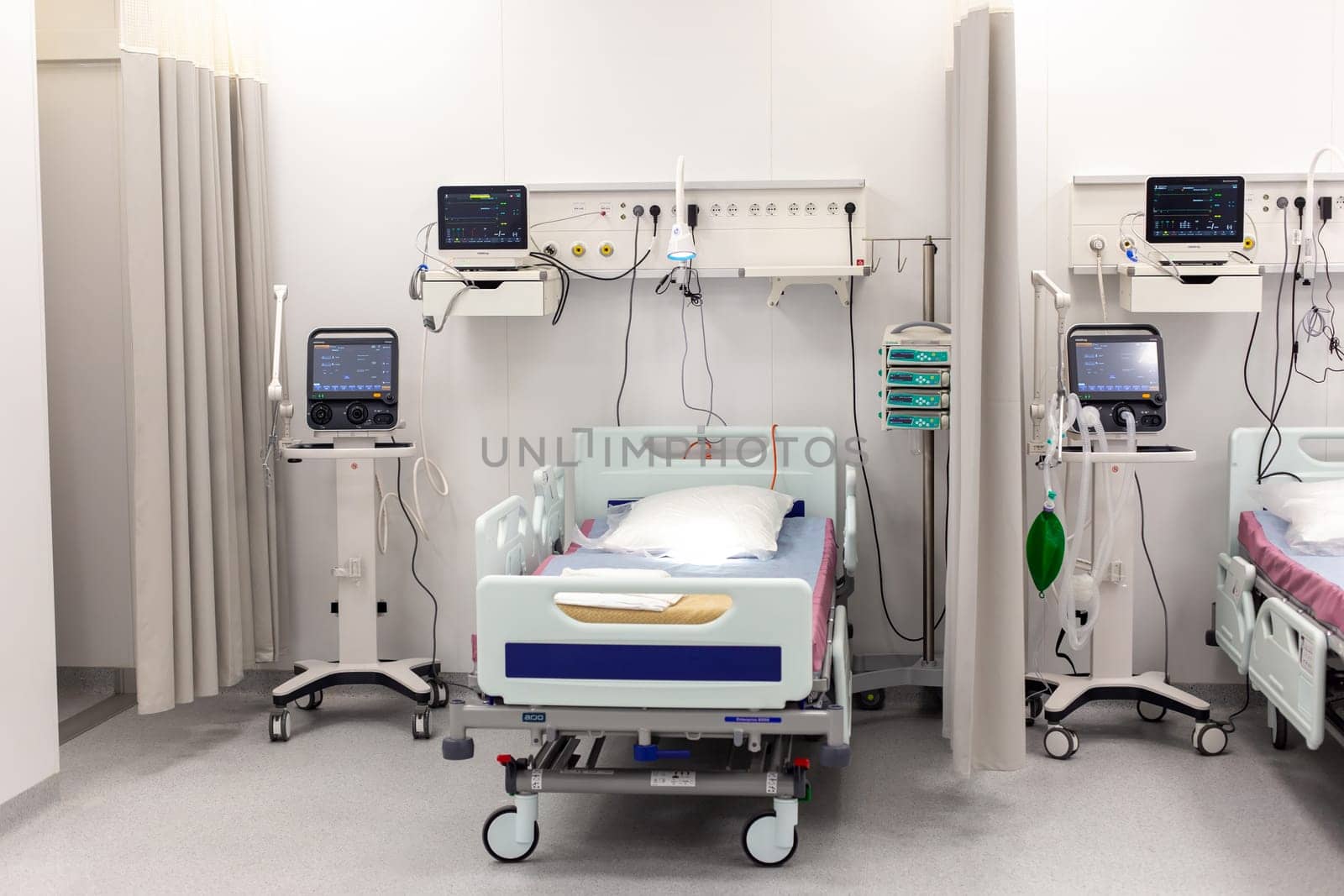 Moscow, Moscow region, Russia - 03.09.2023:hospital bed with vital sign monitors in a well-equipped medical room