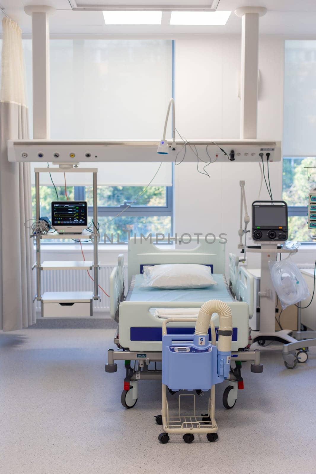 Moscow, Moscow region, Russia - 03.09.2023:An empty hospital room with a bed and life-support equipment, showcasing modern medical facilities.