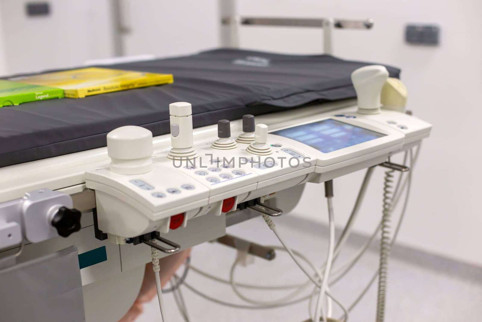 Close-up of an ultrasound machine with probes in a clinical examination room by Zakharova