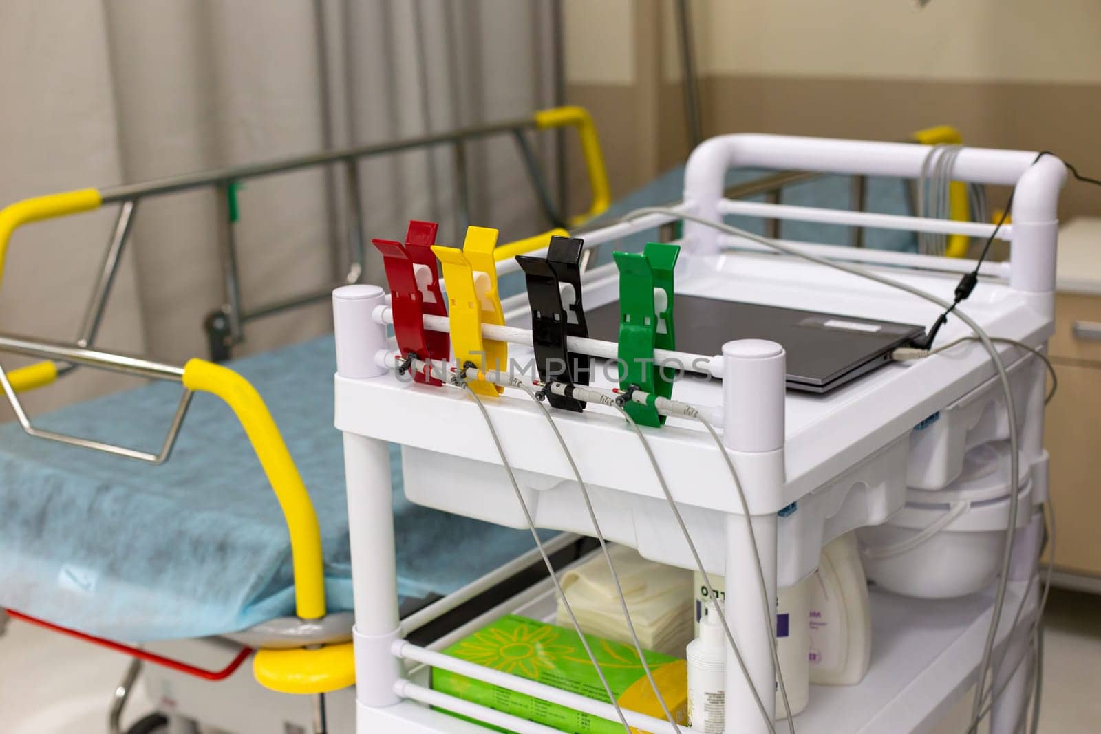 Multi-colored clips for electrodiagnosis, on a medical trolley by Zakharova