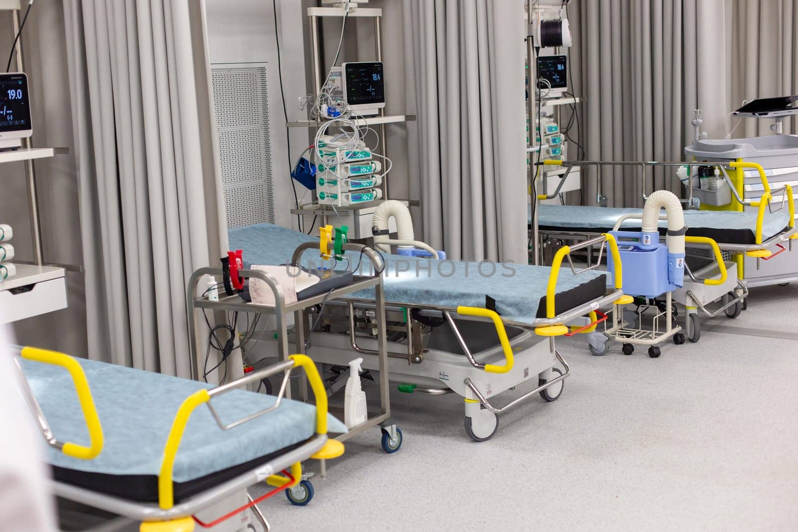 Moscow, Moscow region, Russia - 03.09.2023:Spacious hospital ward with multiple beds, vital signs monitors by Zakharova
