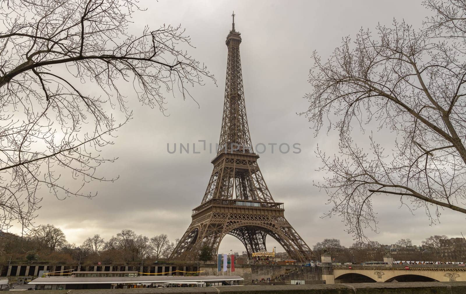 France, Paris - Jan 4, 2024 - Nice scenery of Eiffel Tower and Seine River in Paris at Afternoon. Destinations in Europe. Space for text, Selective focus.