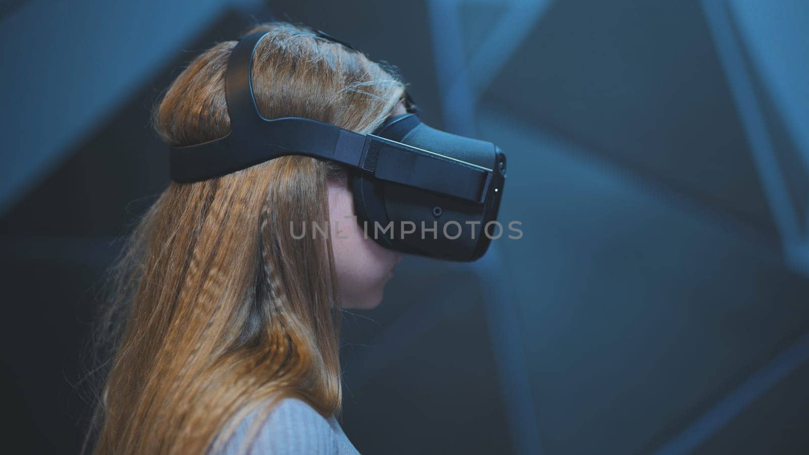 The girl plays virtual reality games in the club. by DovidPro