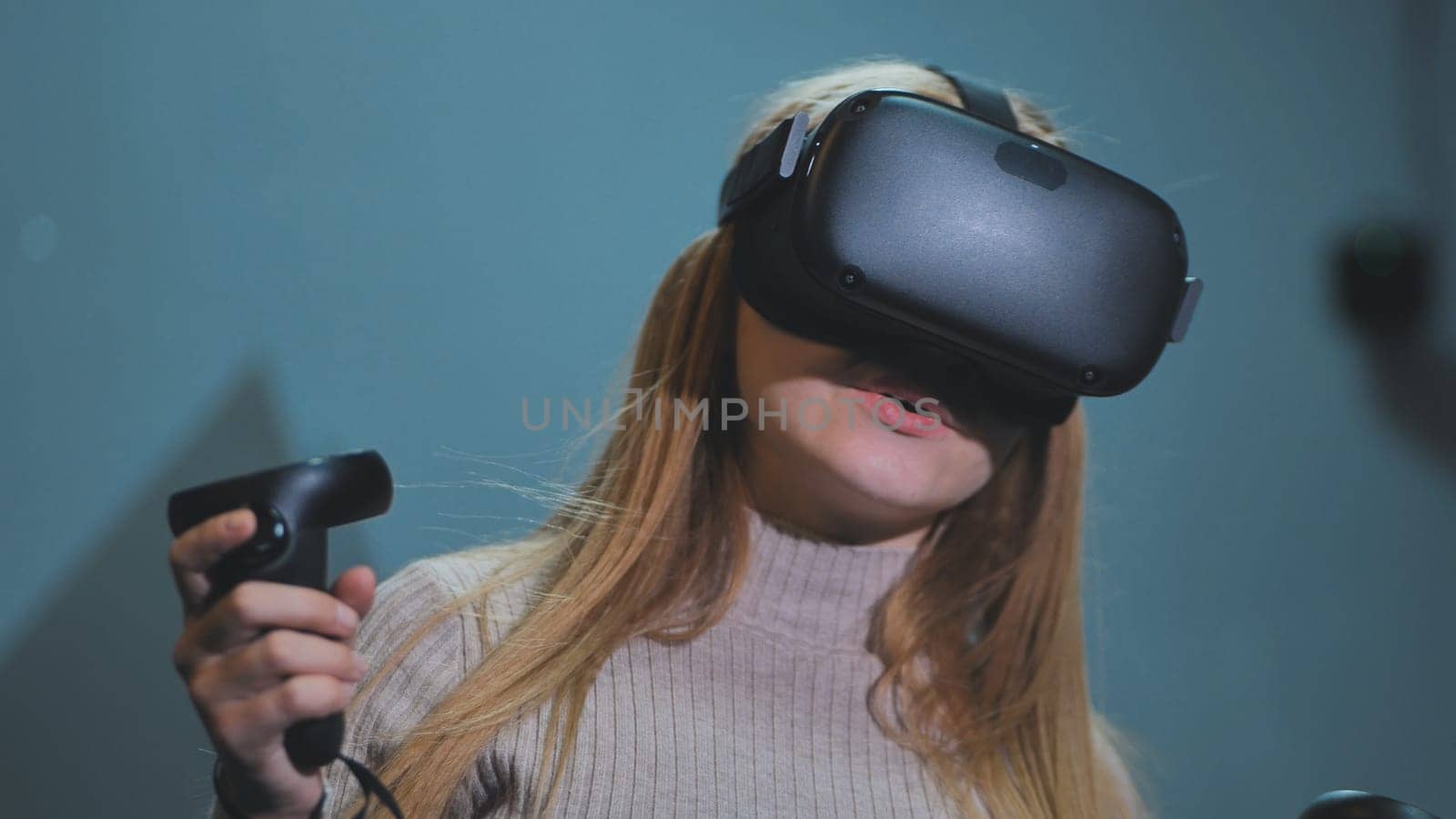 The girl plays virtual reality games in the club. by DovidPro