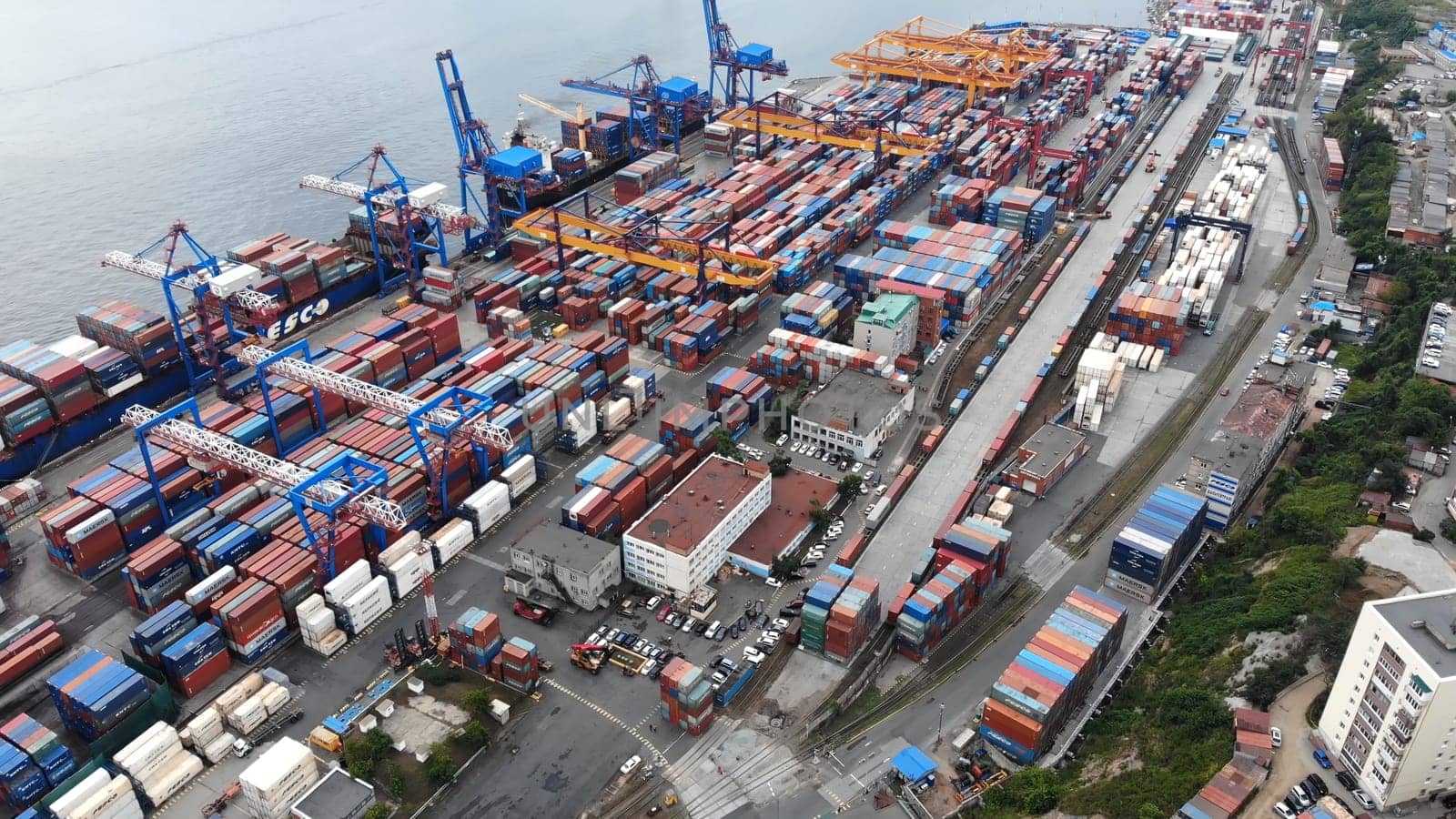 Top view. Vladivostok Commercial Sea Port. Industrial port with containers in Vladivostok