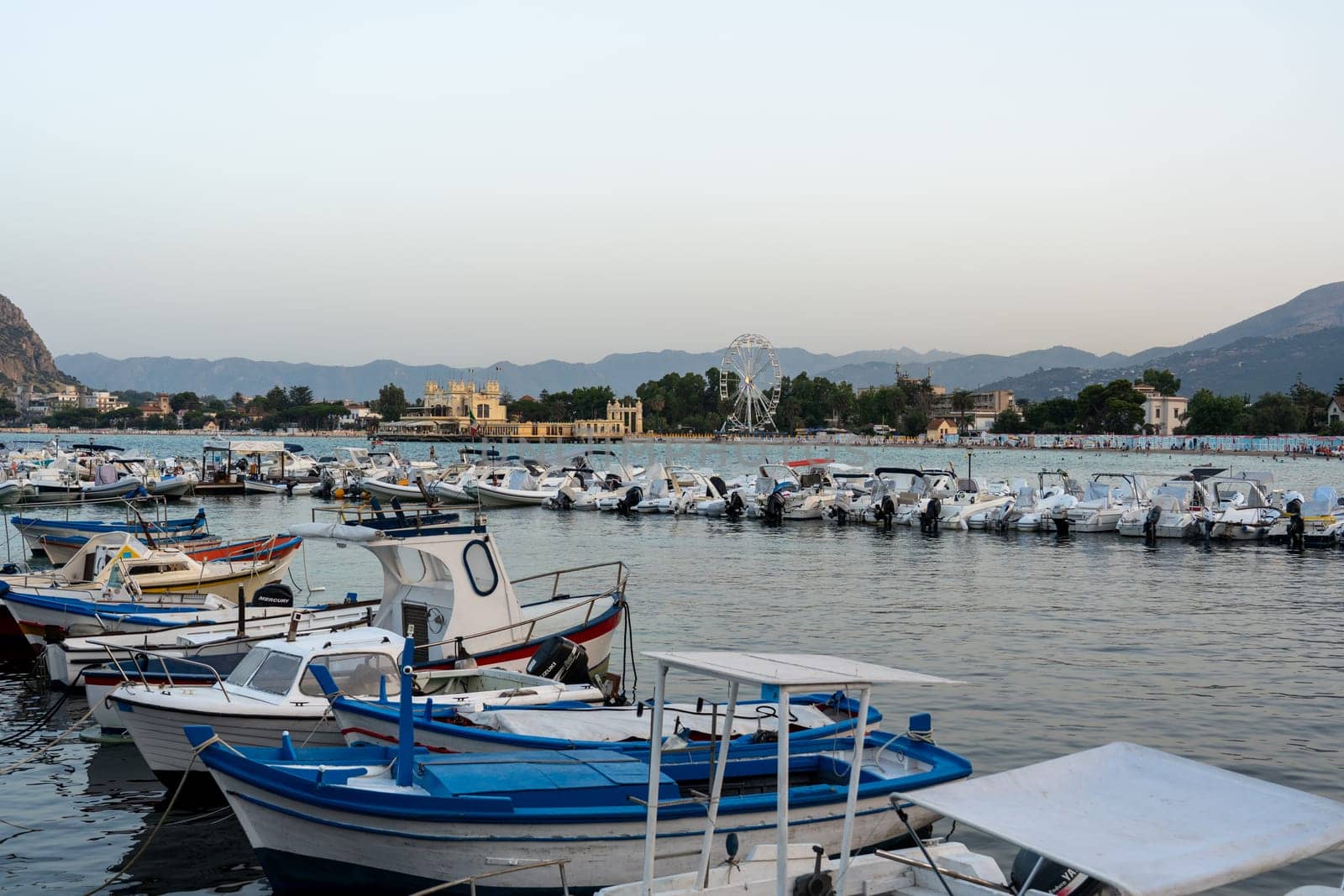 Mondello, Italy - July 17, 2023: Small motorboats anchored at the local marina.