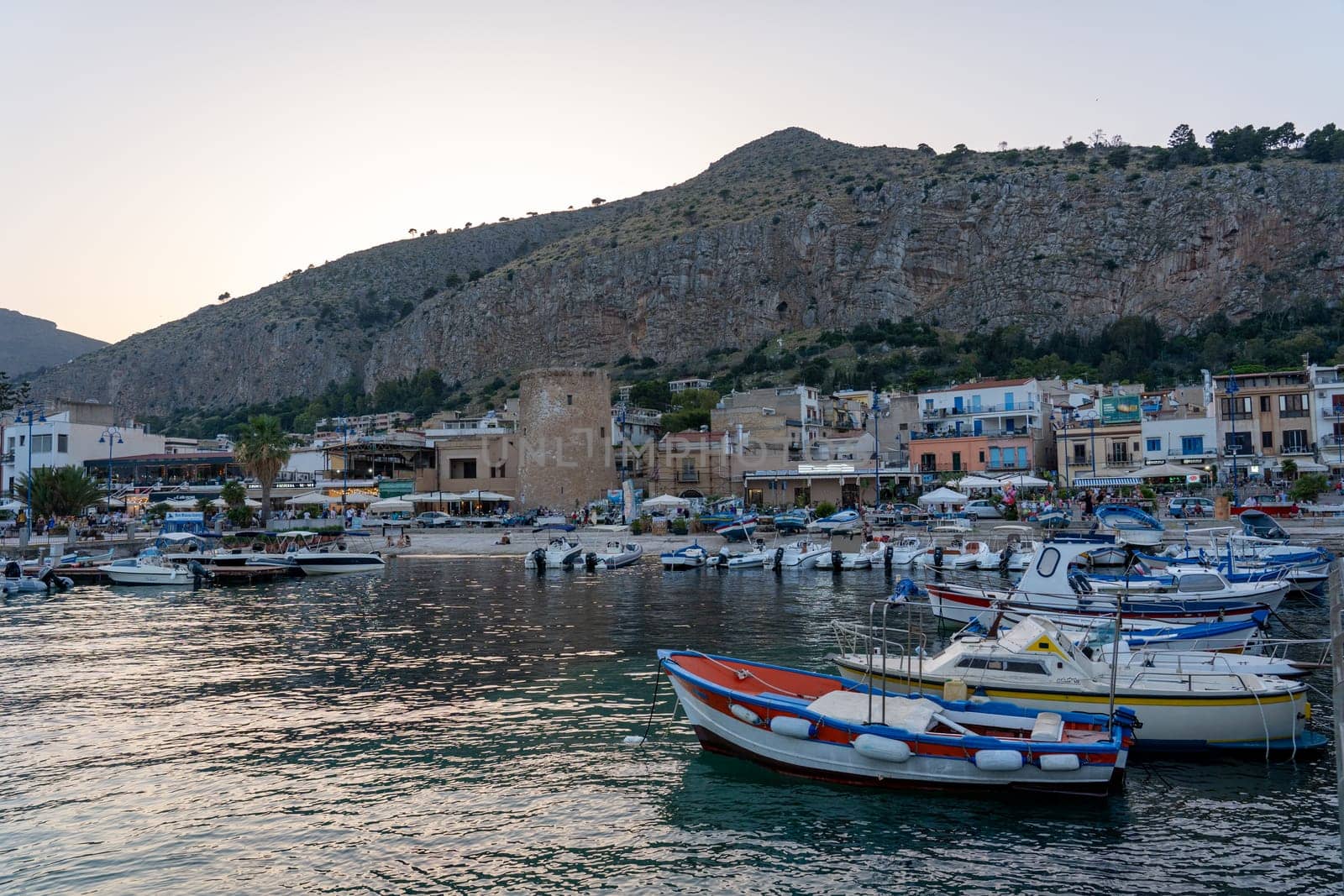 Mondello, Italy - July 17, 2023: Small motorboats anchored at the local marina.