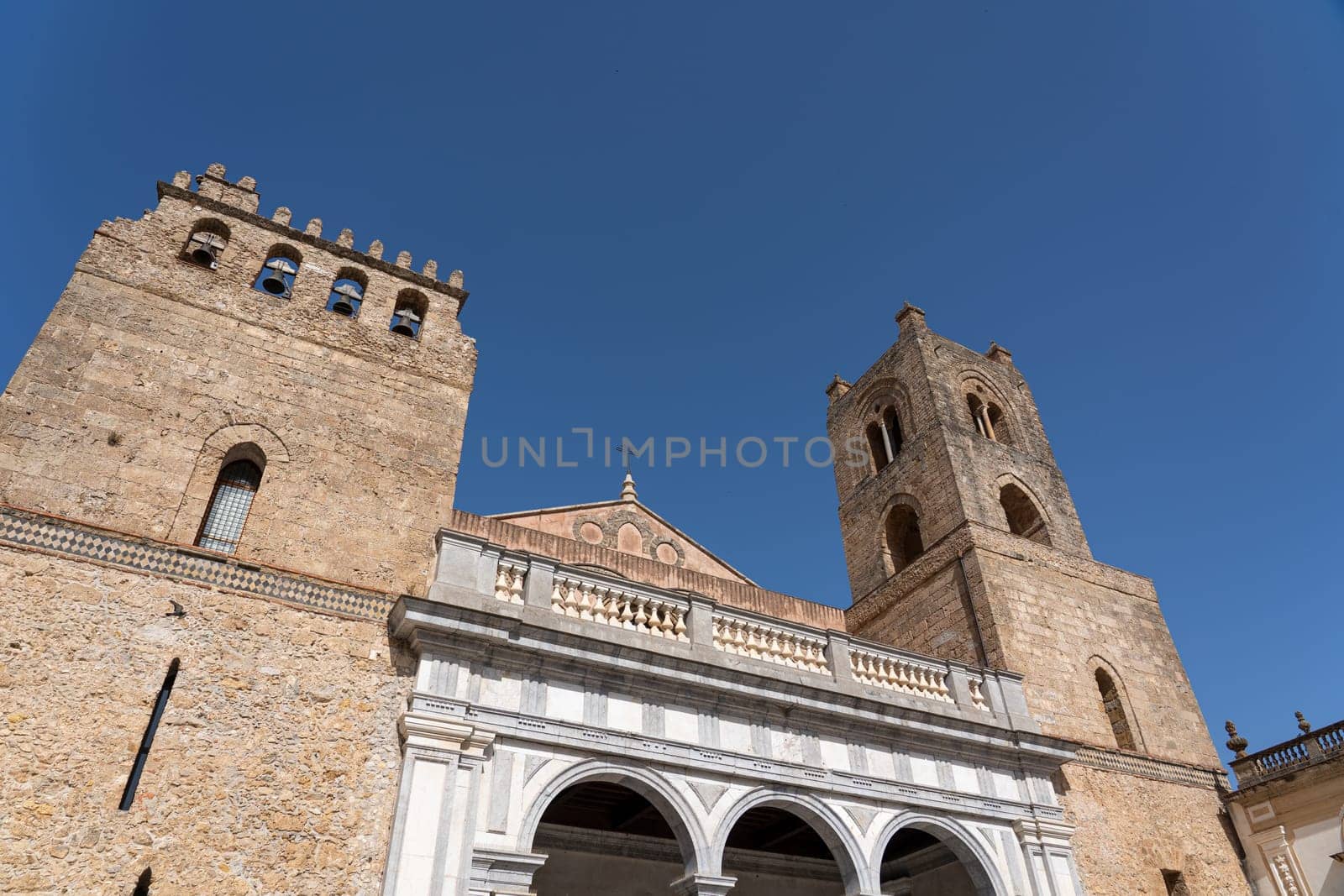 Monreale, Italy - July 18, 2023: Exterior of Monreale Cathedral, a Catholic church and UNESCO world heritage site