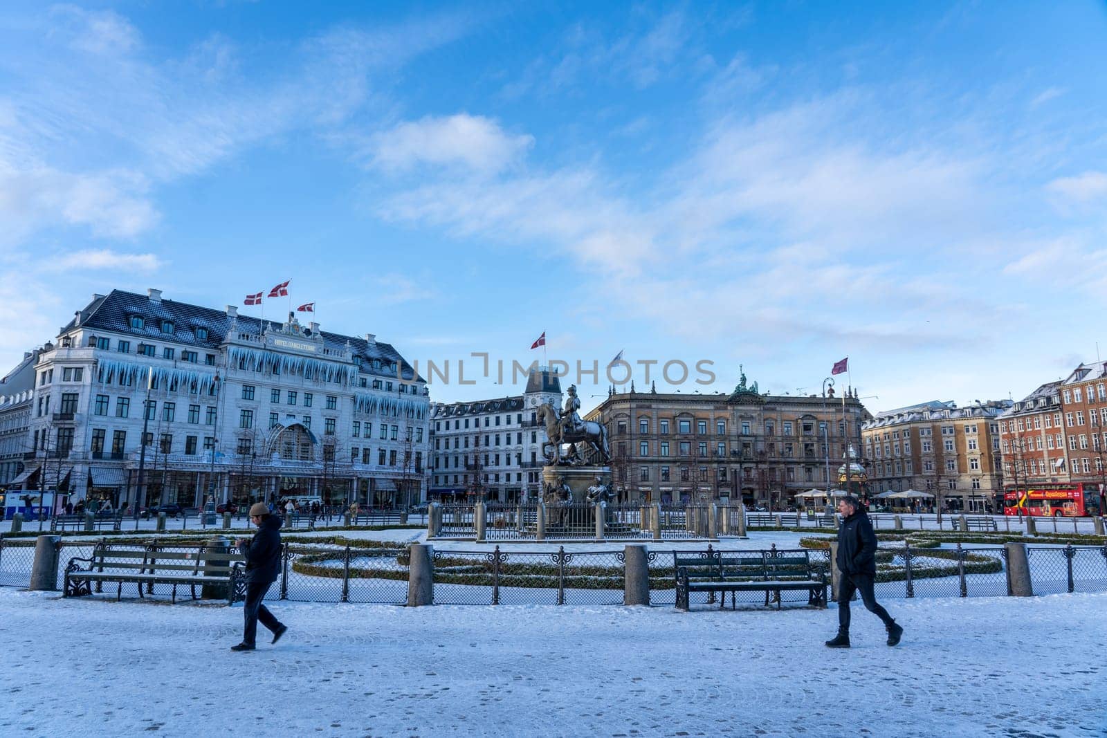 Copenhagen, Denmark - January 4, 2024: Historic Kongens Nytorv Square covered by snow during winter season.