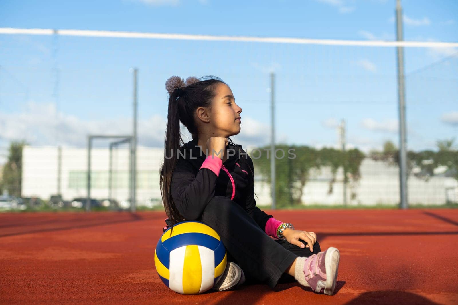 Pretty teen girl with brunette hair, volleyball ball by Andelov13