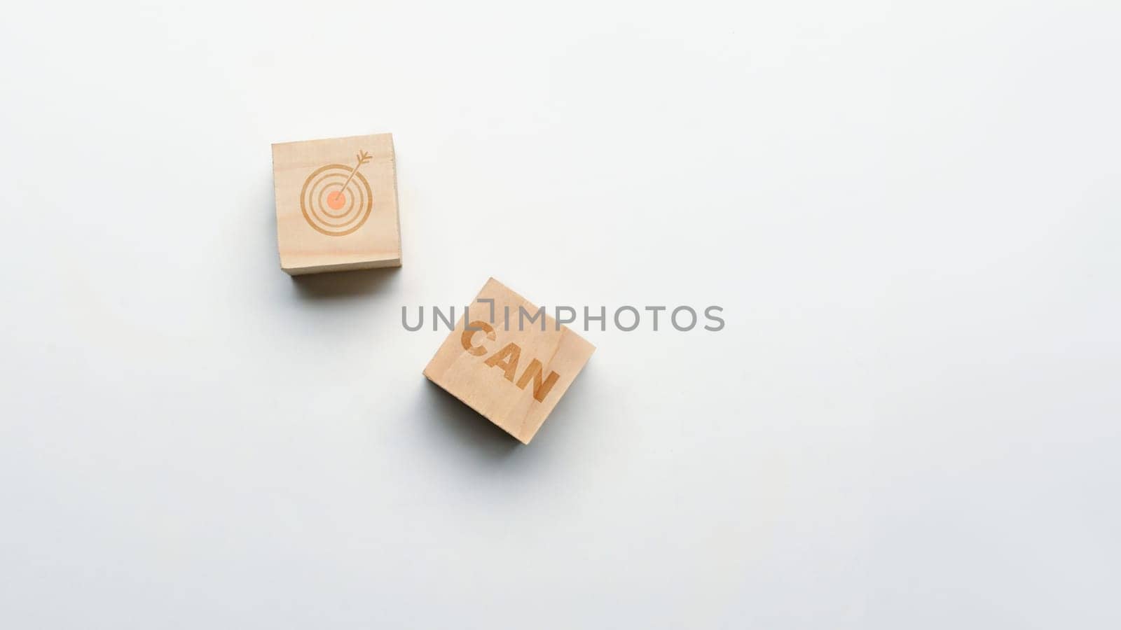 CAN word on wooden cube with target icon on white background. Motivational and inspirational concept.